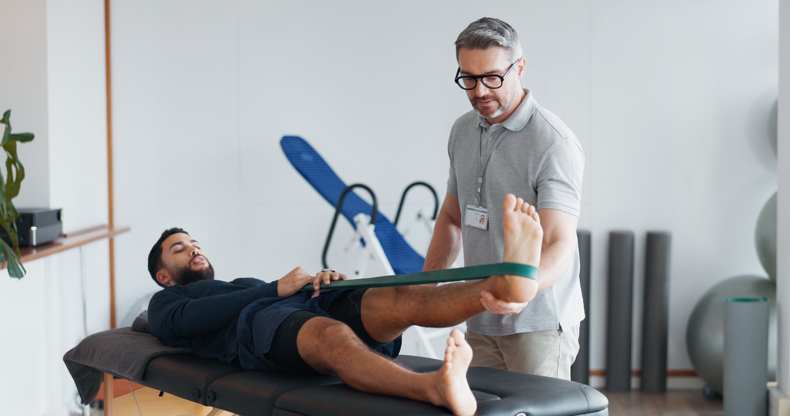 Physiotherapist assessing a patient's shoulder mobility